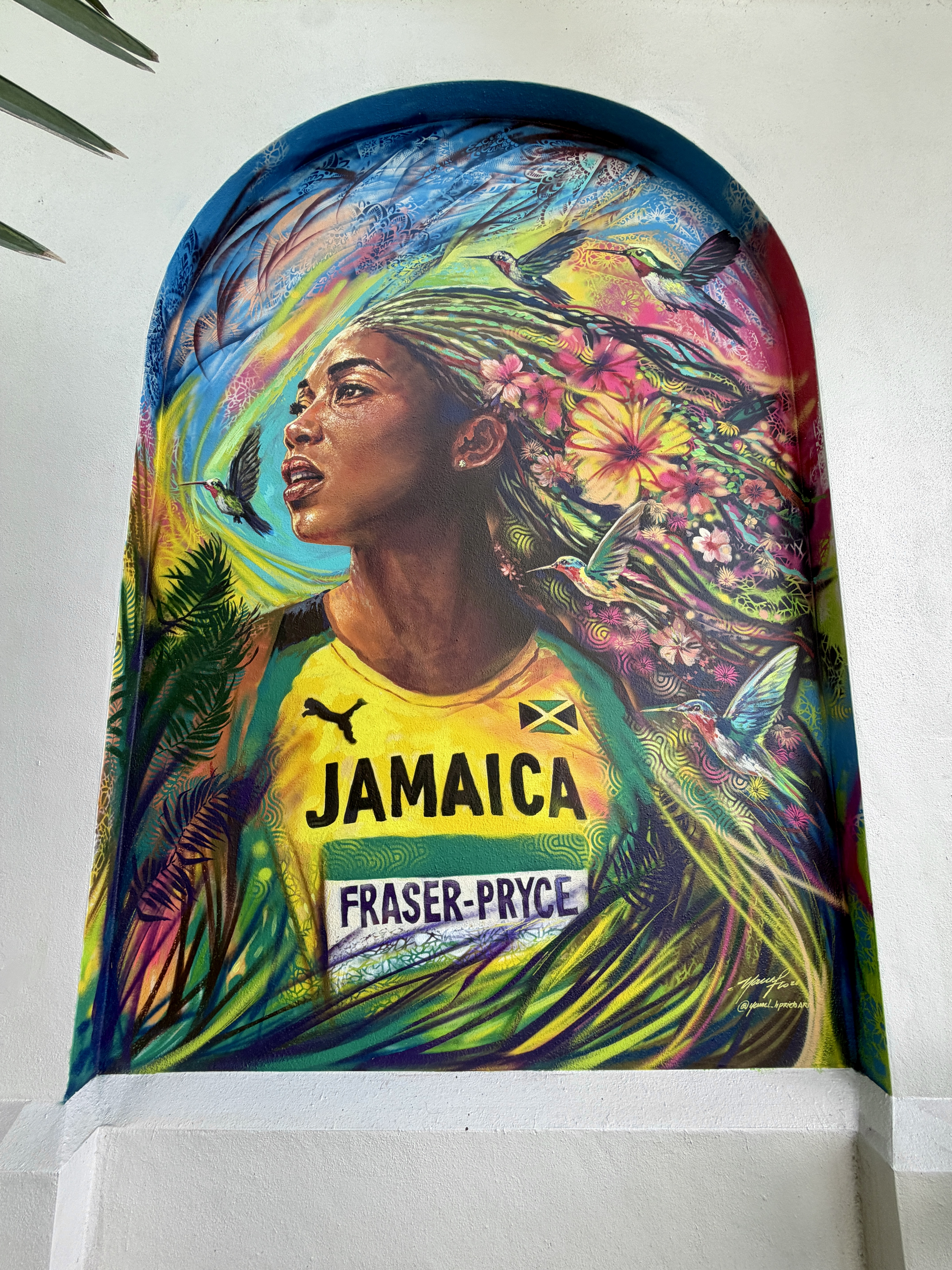 Image of Shelly Ann Fraser Pryce wall mural at the Miramar Cultural Center